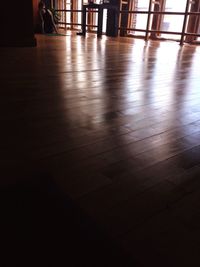 Rear view of woman practicing yoga in studio