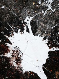 High angle view of snow on water