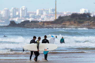 People enjoying on beach