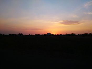 Scenic view of silhouette landscape against sky during sunset