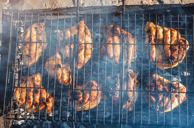 Close-up of meat on barbecue grill