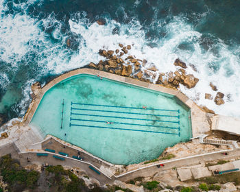 High angle view of swimming pool by sea