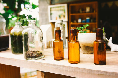 Close-up of glass bottles on table