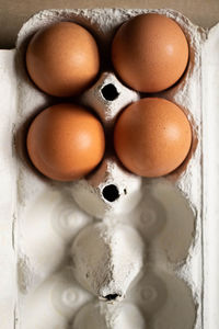 Directly above shot of eggs in container