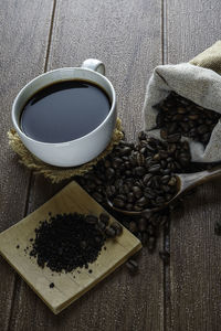 High angle view of coffee cup on table