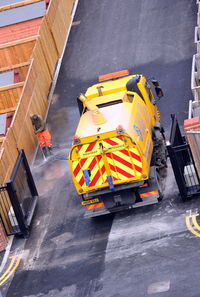 High angle view of yellow working on road