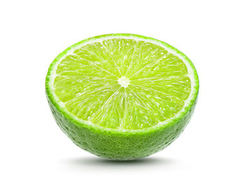 Close-up of lemon slice against white background
