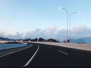 Empty road against sky