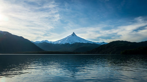 Scenic view of lake and mountains against sky - puntiagudo volcano, chile 