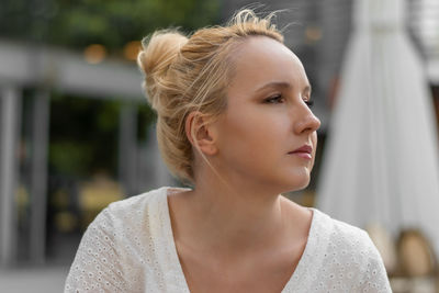 Close-up of young woman looking away