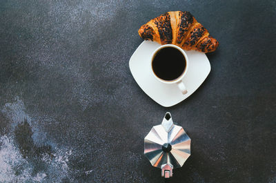 High angle view of coffee cup on table