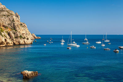 Scenic view of sea against clear blue sky