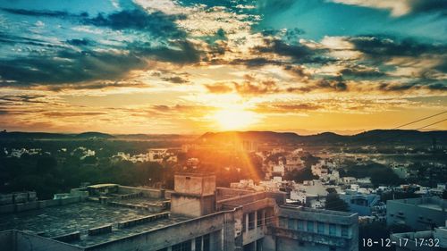 High angle view of townscape against sky at sunset