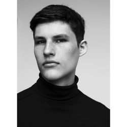 Portrait of young man against white background