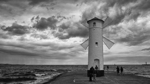 View of lighthouse against cloudy sky