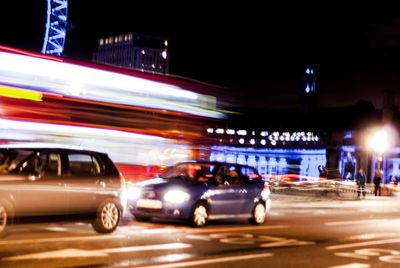 Traffic light trails on road in city at night