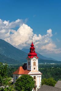 Low angle view of red and building against sky