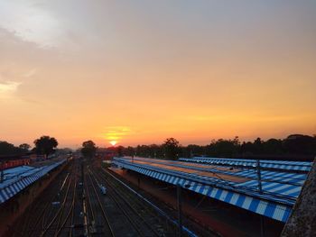 High angle view of train station against sky during sunset