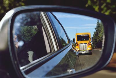 Close-up of side-view mirror of car