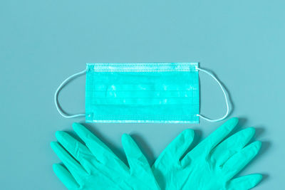 Close-up of blue object against colored background