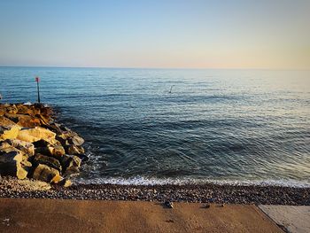 Scenic view of sea against clear sky