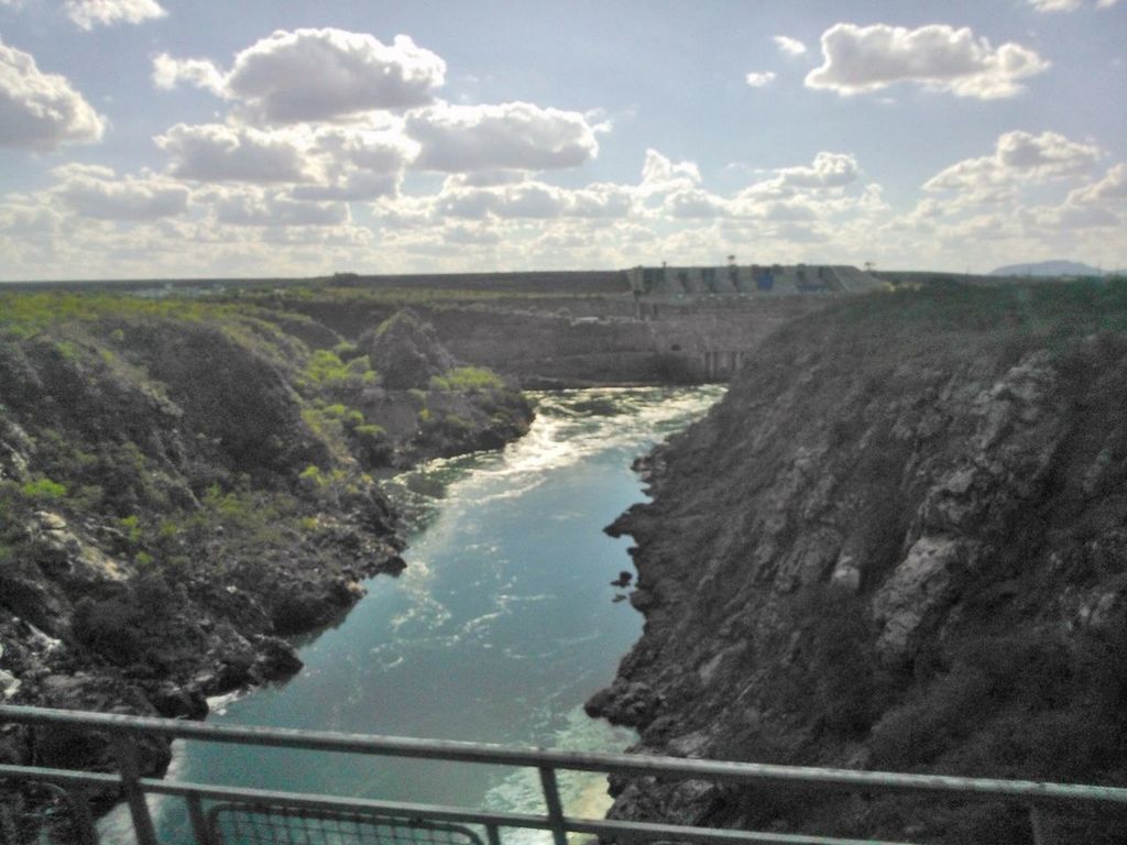 sky, water, tranquil scene, scenics, tranquility, cloud - sky, nature, beauty in nature, landscape, mountain, sea, cloud, high angle view, railing, river, day, cloudy, idyllic, non-urban scene, outdoors