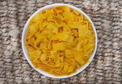 Bowl of cooked plain butternut pasta on rustic table