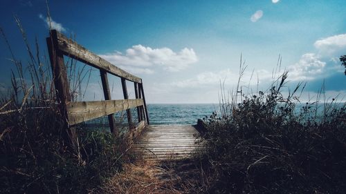 Scenic view of sea against cloudy sky