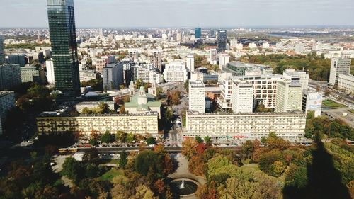 High angle view of buildings in city against sky