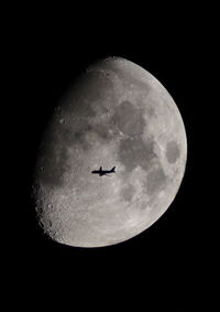 Low angle view of moon against sky at night