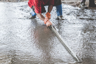 Low section of people standing in water