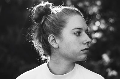 Close-up of thoughtful young woman at park