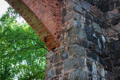 Low angle view of brick wall