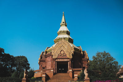 Low angle view of historic building against clear blue sky