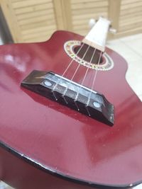 High angle view of guitar on table