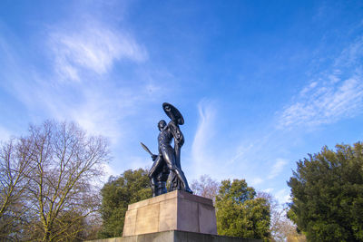 Low angle view of statue against sky