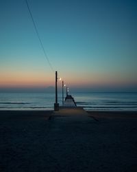 Scenic view of sea against clear sky during sunset