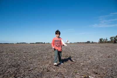 Child running with toy airplane