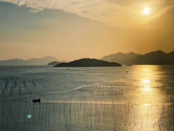 Scenic view of sea against sky during sunset