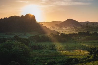 Scenic view of landscape against sky during sunset