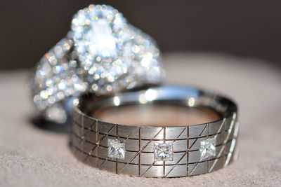 Close-up of wedding rings on table