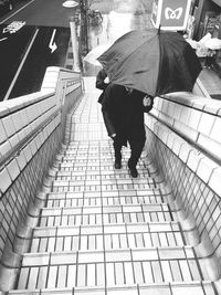 Woman walking on footpath