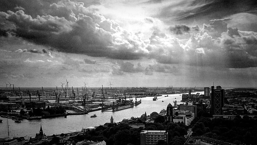 transportation, nautical vessel, water, sky, sea, harbor, cloud - sky, city, cloudscape, cloud, day, calm, outdoors, cloudy, ocean, waterfront, tranquility, nature, no people, scenics, coastline, aerial view, horizon, commercial dock, large group of objects, tranquil scene