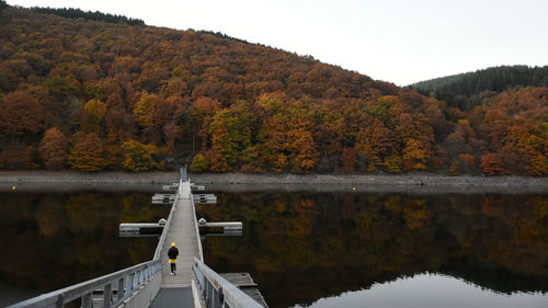 Scenic view of lake against clear sky during autumn