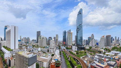 Modern buildings in city against sky