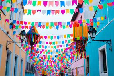 Low angle view of multi colored flags