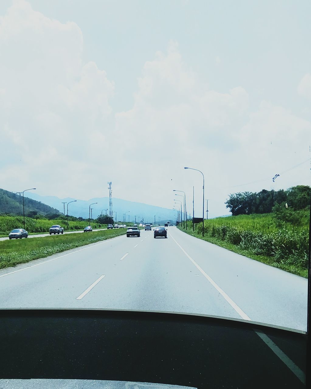 ROAD SEEN FROM CAR WINDSHIELD