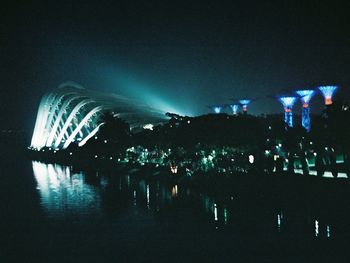 Illuminated ferris wheel at night