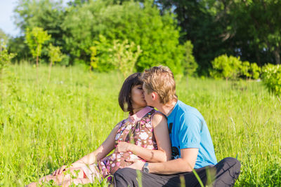 Couple sitting on a field