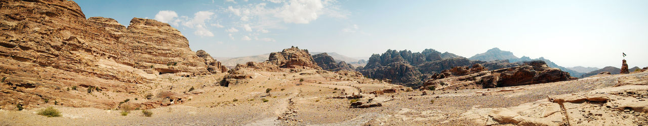 Panoramic view of rocky mountains against sky